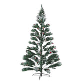 A flocked artificial Christmas tree with green and white snow-dusted needles, decorated with small red berries and pinecones, standing on a black metal stand against a plain white background.