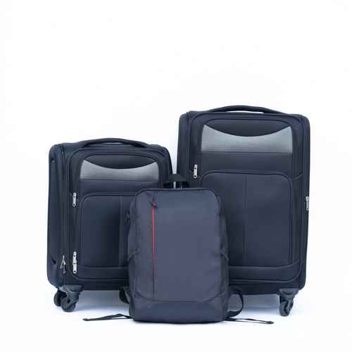 Set of black suitcases and backpack on a white background