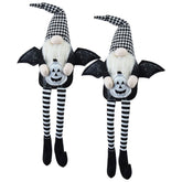Two Halloween-themed gnomes with bat wings and striped legs on a white background
