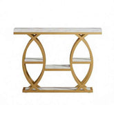 A modern console table featuring a white marble-patterned top and shelves, supported by a gold-finished metal frame with interlocking circular arches.