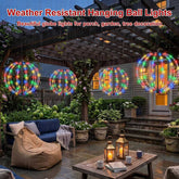 Weather-resistant hanging LED ball lights on a garden patio at night