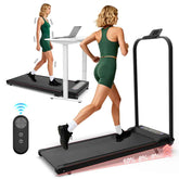 Woman in green sportswear walking on a treadmill with digital display, next to a desk with laptop for home fitness