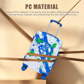 A blue and white PC hard-shell suitcase with green paint splatter graphics, suspended diagonally by a rope against a beige background with text highlighting its durable PC material.