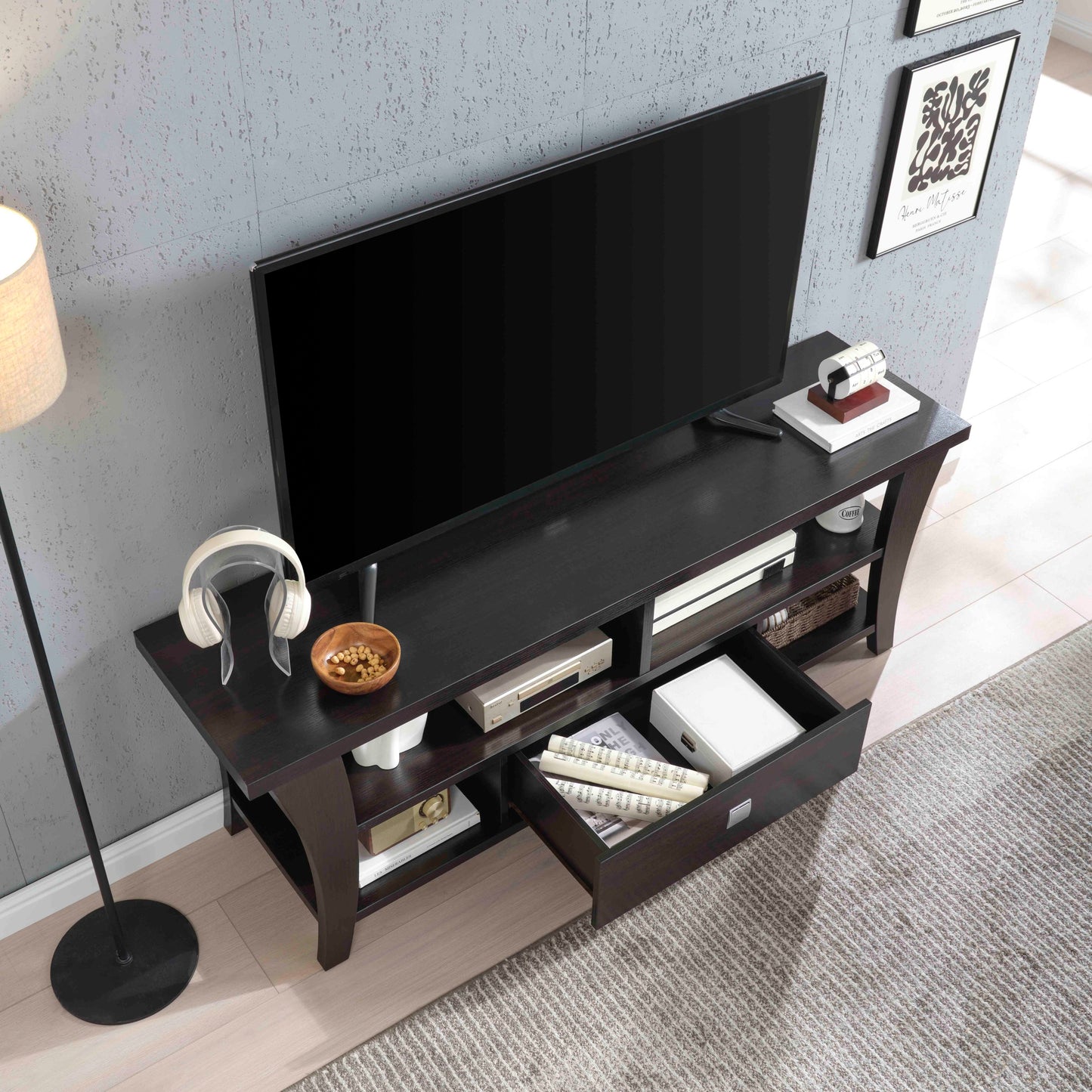 Top view of TV Stand with Storage showing organized compartments, open shelves, and central drawer under a mounted TV.
