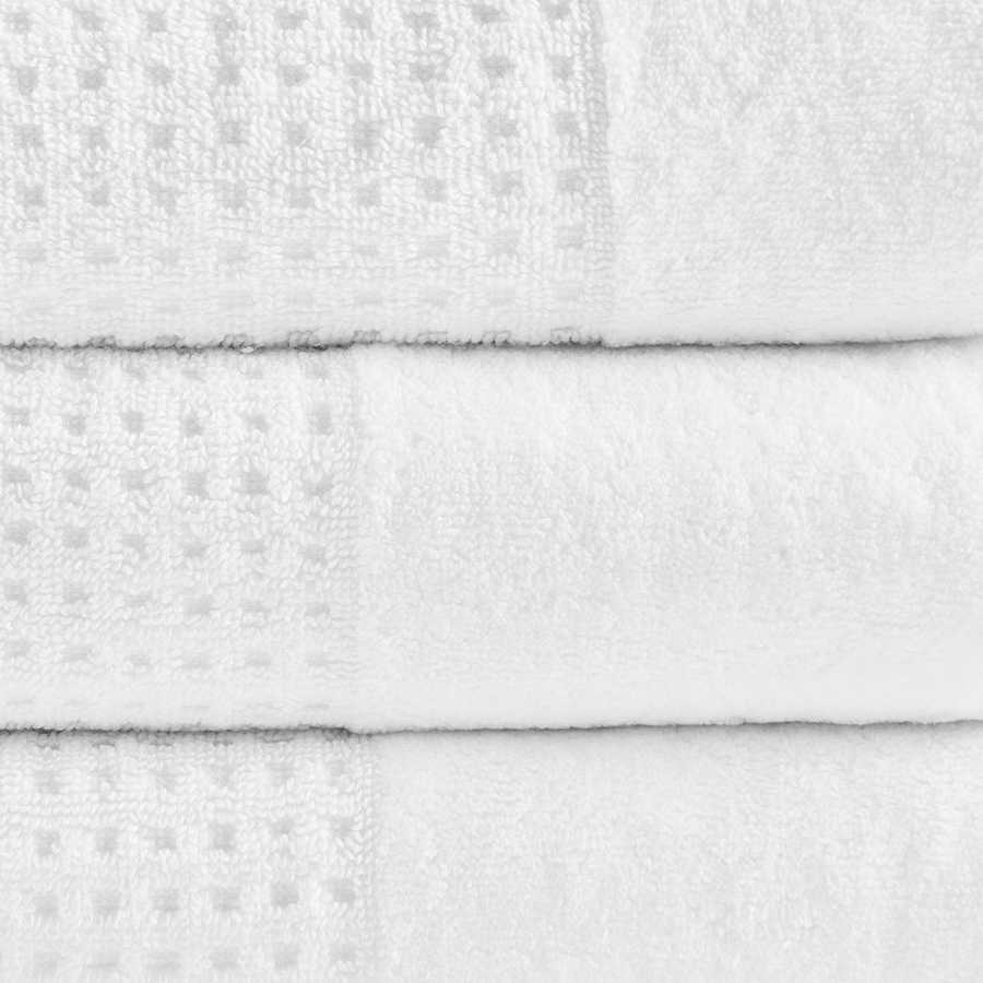 Close-up of white Cotton Waffle Jacquard Bath Towels showing textured jacquard weave and plush absorbent fabric in 6 piece set.