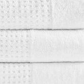 Close-up of white Cotton Waffle Jacquard Bath Towels showing textured jacquard weave and plush absorbent fabric in 6 piece set.