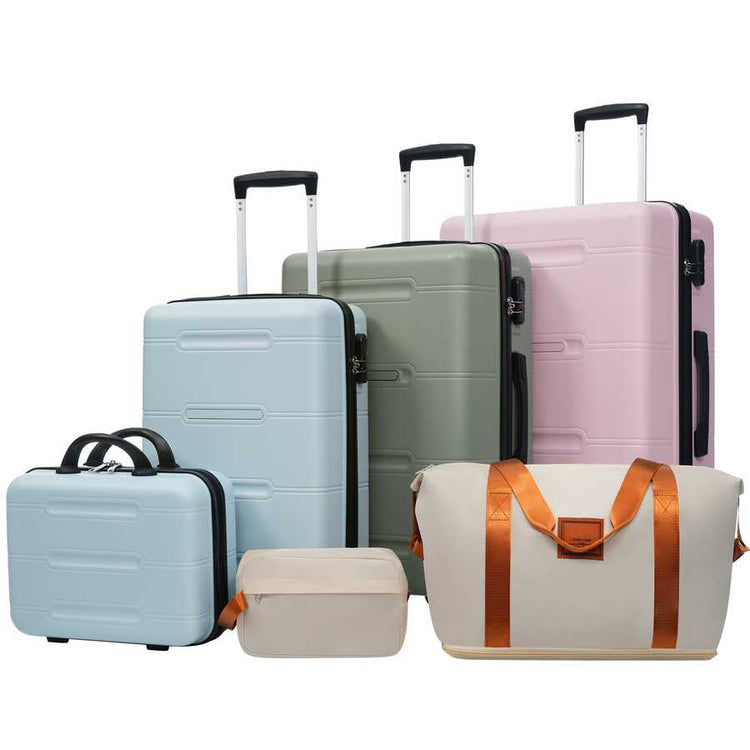 Set of suitcases and travel bags in various colors on a white background