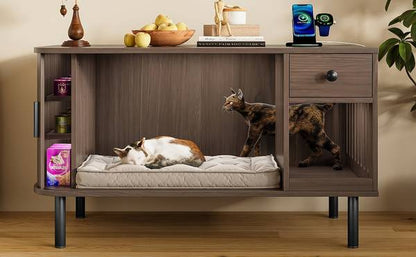 Interior view of cat litter box enclosure with two cats resting on cushion, side storage shelves visible.