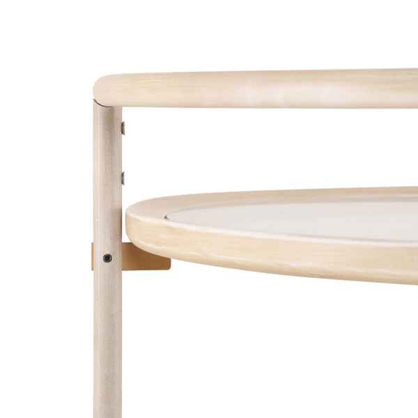 Wooden changing table with a white surface on a white background