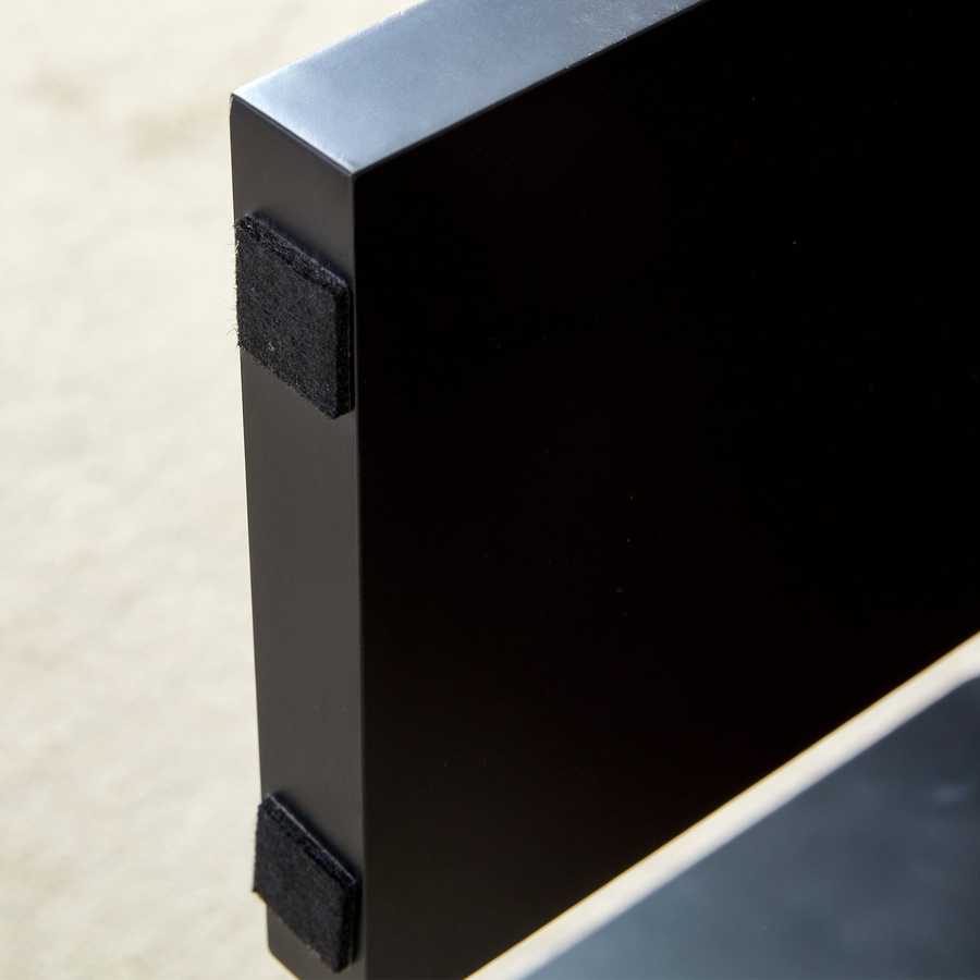 Protective pads on black leg of Walnut MDF Coffee Table, ensuring floor safety and stability in modern home environments.