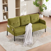 Green sofa with a white blanket in a living room setting