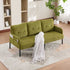 Green sofa with a white blanket in a living room setting