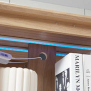 Close-up of LED lighting strip and wiring inside the lighted curio cabinet, highlighting integrated illumination features.