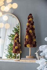 Christmas tree table decor in front of a mirror