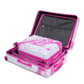 Close-up of pink printed spinner luggage with pink zippers, hexagon pattern, and pink corner protectors for durability