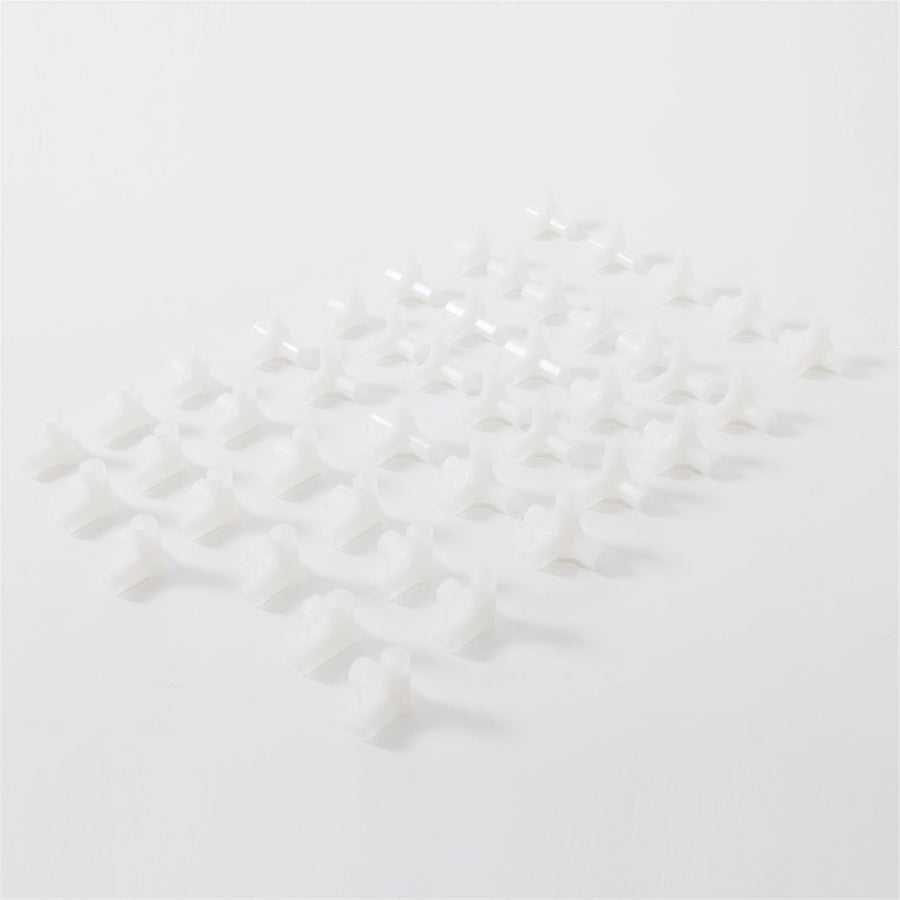Set of white plastic connectors for assembling non-woven fabric shoe rack with 6 rows and 12 lattices, durable and lightweight.