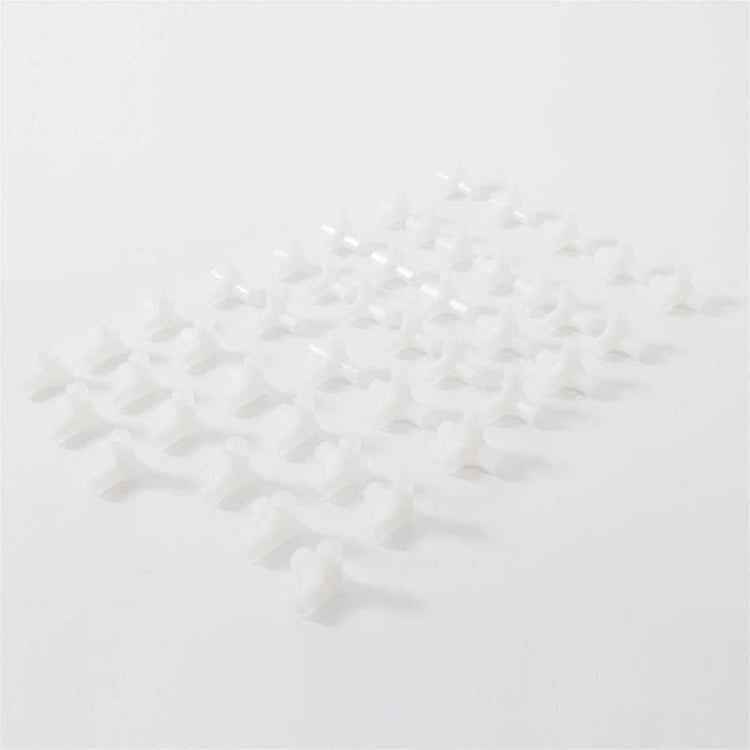 Set of white plastic connectors for assembling non-woven fabric shoe rack with 6 rows and 12 lattices, durable and lightweight.