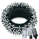 Coiled string light set with remote control and power adapter on a white background