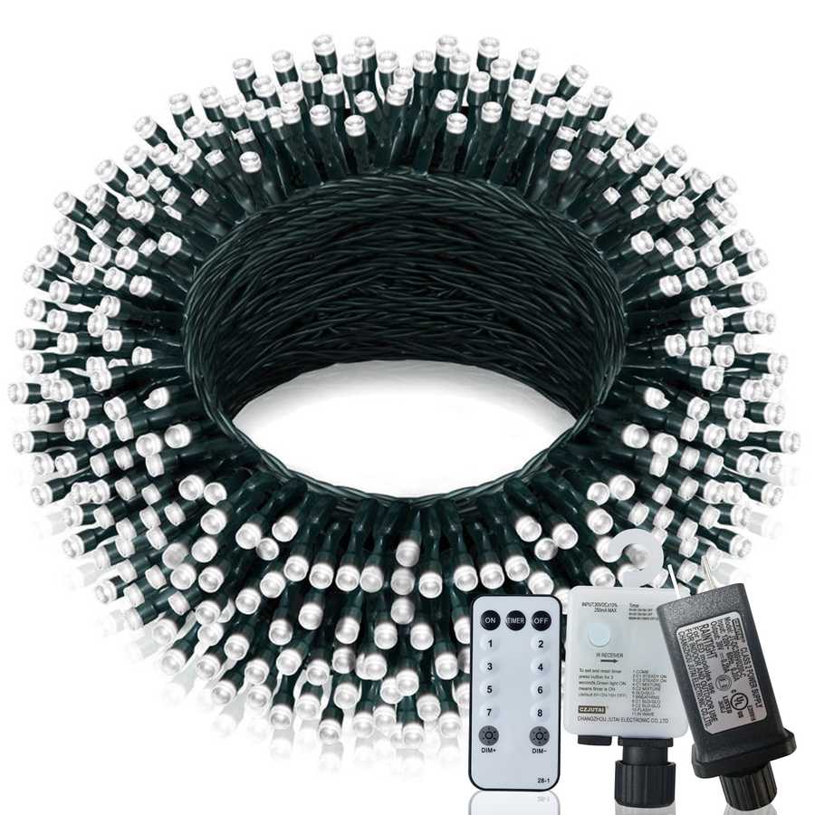 Coiled string light set with remote control and power adapter on a white background