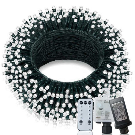 Coiled string light set with remote control and power adapter on a white background