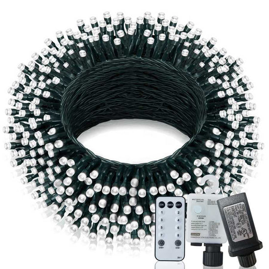 Coiled string light set with remote control and power adapter on a white background