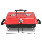 Red portable grill with black handle on a white background