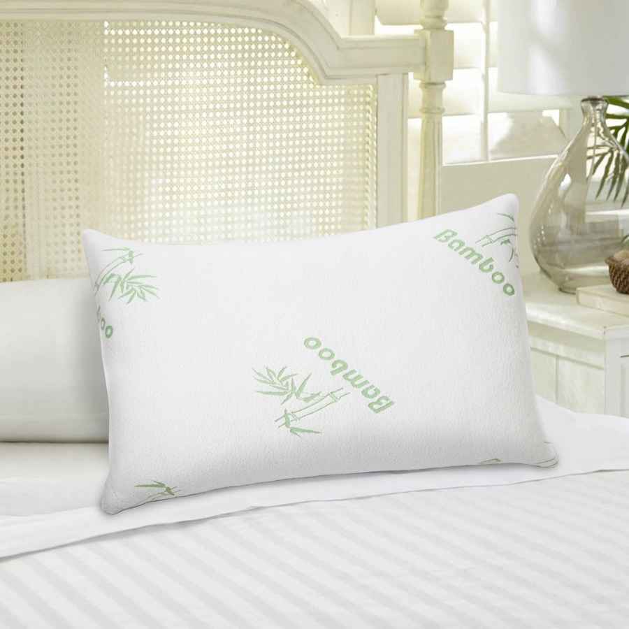 Bamboo memory foam pillow on bed with white linens