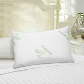 Bamboo memory foam pillow on bed with white linens