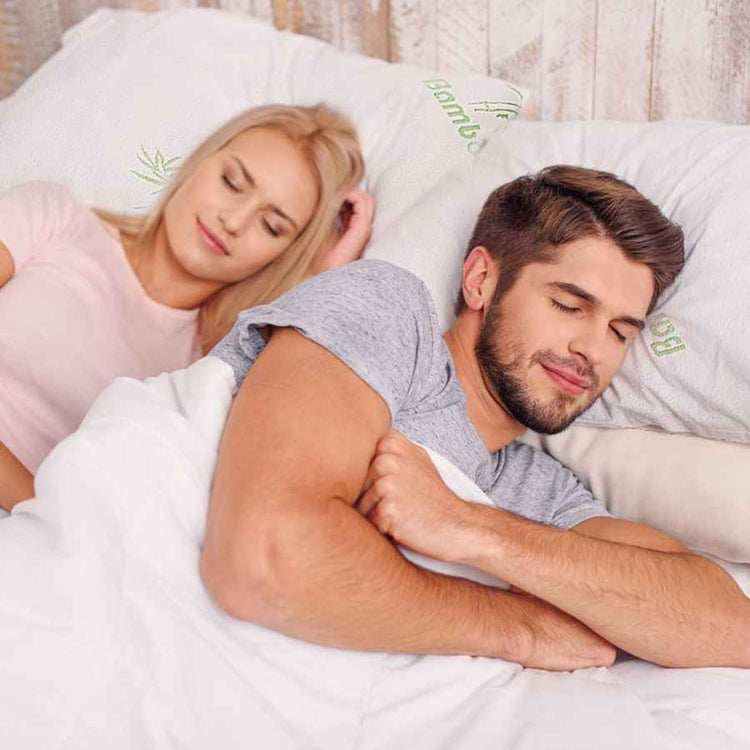 Couple sleeping on bamboo memory foam pillows