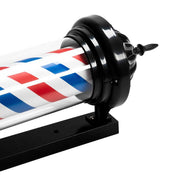 Close-up of barber pole LED sign light with black mounting base