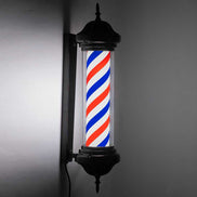 Wall-mounted barber shop LED sign light illuminated at night