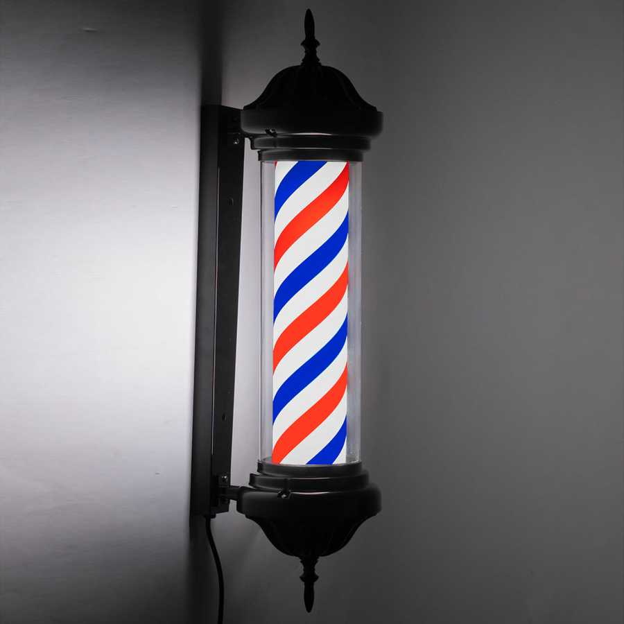 Wall-mounted barber shop LED sign light illuminated at night