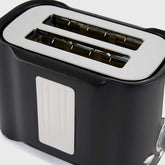 Top view of 2 slice toaster showing wide slots for thick bread slices and even toasting performance.