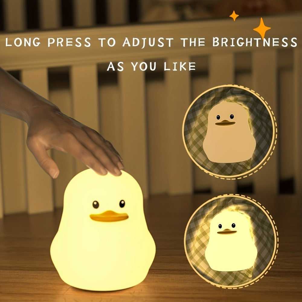 Hand tapping the duck silicone night light to adjust brightness
