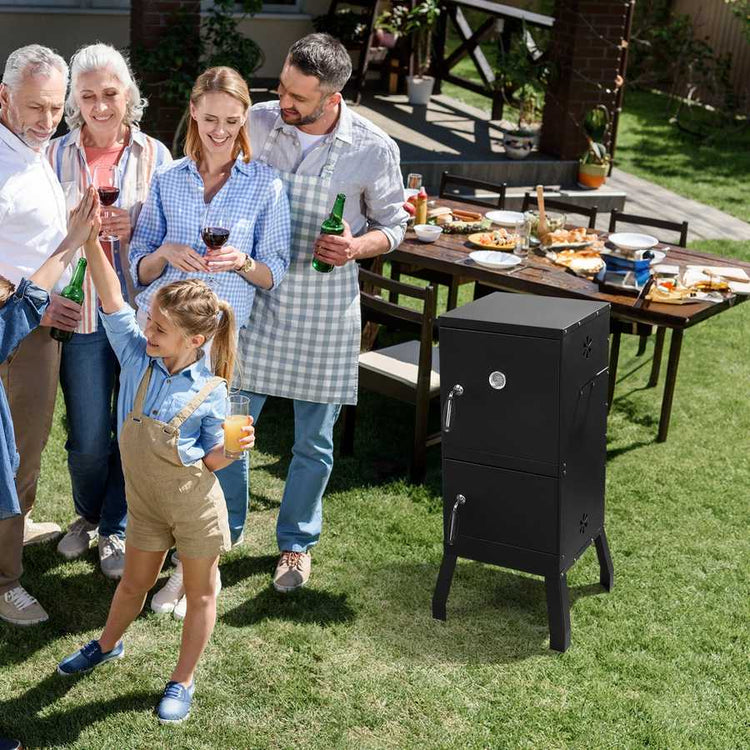 Family gathered around a barbecue grill in a backyard setting
