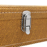 Close-up of a brown textured suitcase with a silver latch on a white background