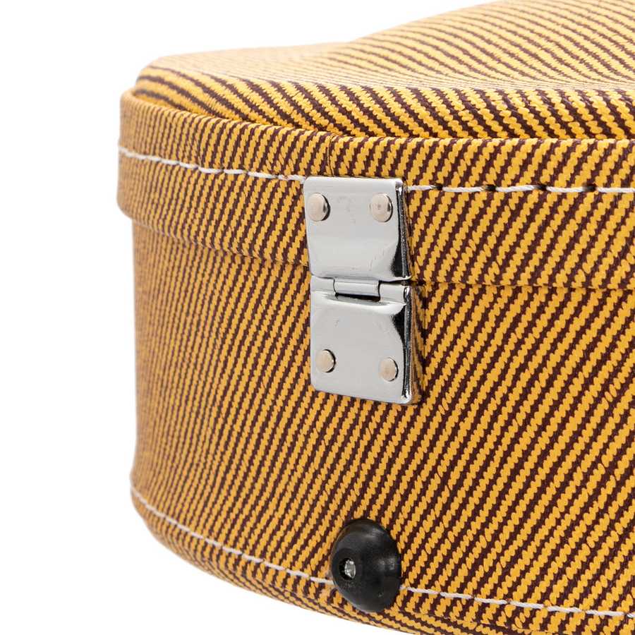 Close-up of a yellow textured suitcase with a metal latch on a white background