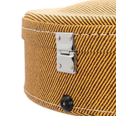 Close-up of a yellow textured suitcase with a metal latch on a white background