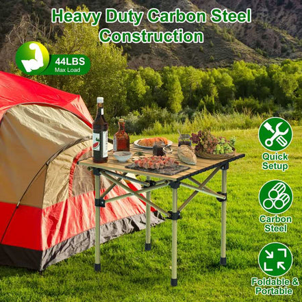 Camping scene with a table, tent, and food setup in a natural setting.