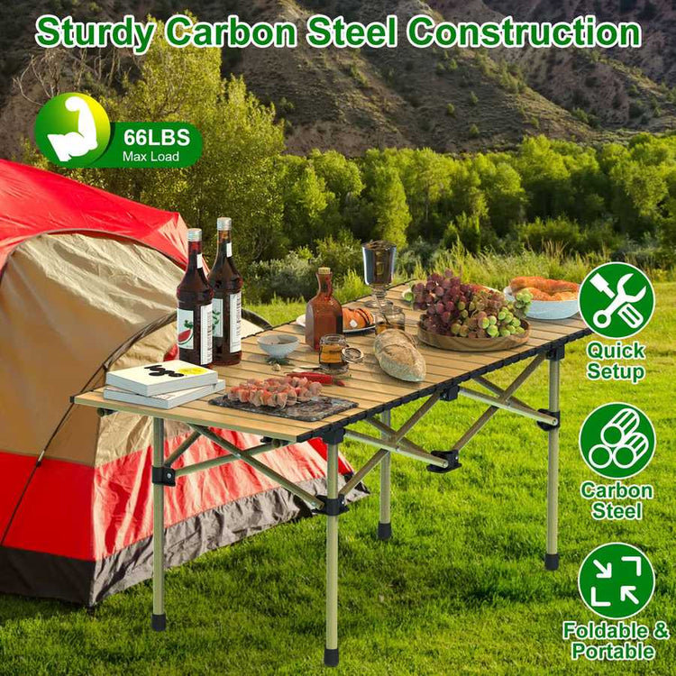 Camping table with food and drinks next to a tent in a scenic outdoor setting