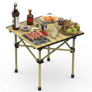 Portable folding table with food items on a white background