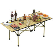 Portable folding table with food and drinks on a white background