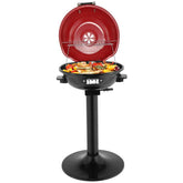 Red portable grill with food on a white background
