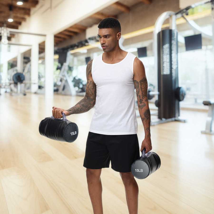 Man using 30lb Adjustable Water Dumbbells in a gym setting, demonstrating their use for strength training and travel-friendly workouts.
