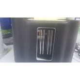 Side view of 2 slice toaster with sleek black finish and stainless steel accent, designed for modern kitchen aesthetics.