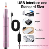 Pink USB interface device with accessories on a pink background