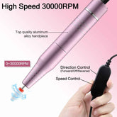 Pink dental handpiece with control panel, labeled features on a pink background