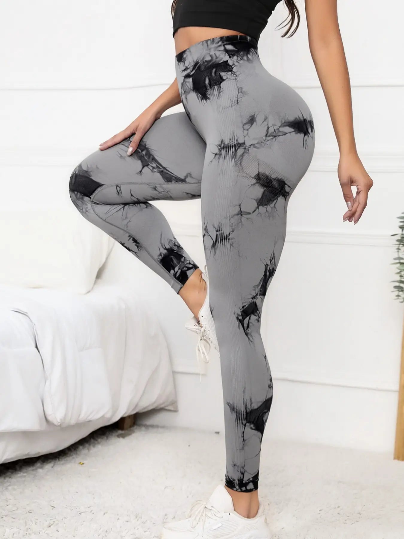 Women's high waist scrunch leggings in gray with compression fit and marble design, perfect for activewear and shaping support.