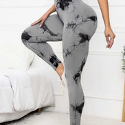 Gray scrunch leggings for women with black tie-dye pattern, featuring high waist and tummy control for gym and yoga sessions.