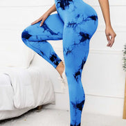 High waist scrunch leggings in blue tie-dye design, offering compression fit and tummy control for women’s activewear needs.
